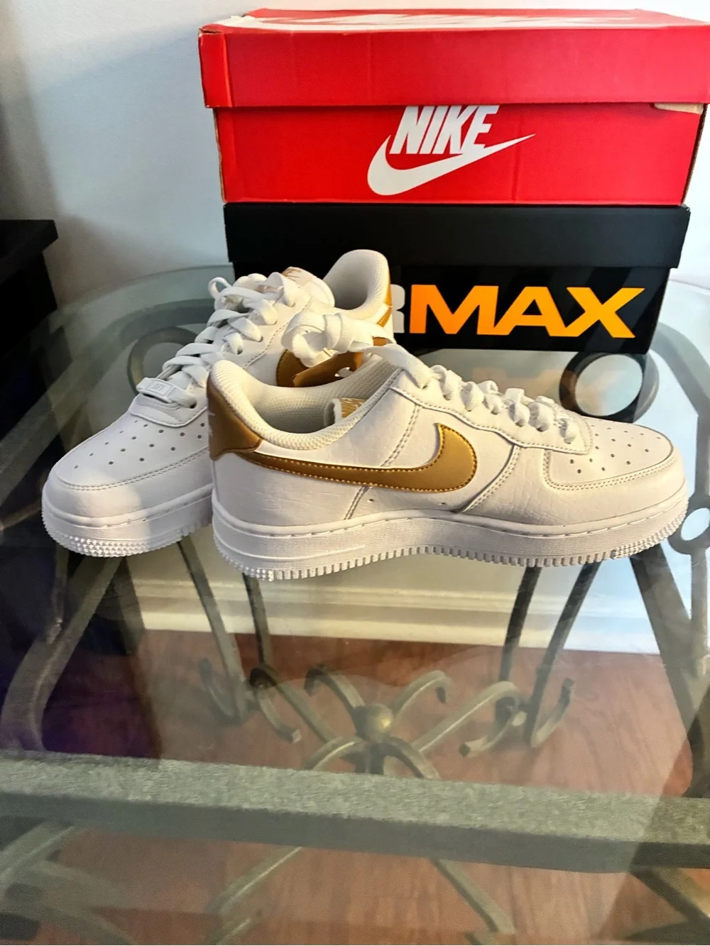 Nike White Sneakers with Gold Swoosh